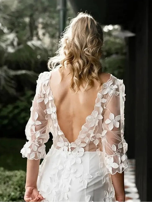 Elegant Backless A-Line Wedding Gown with Lace Appliques and Floor-Length Design