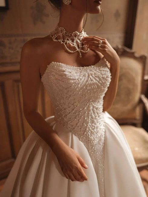 Strapless Beaded Pearls Wedding Dress Ball Gown With Button Back And Court Train Silhouette