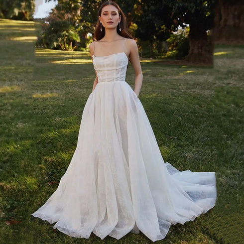 Customized Spaghetti Straps Wedding Dresses with Pockets and Backless Design