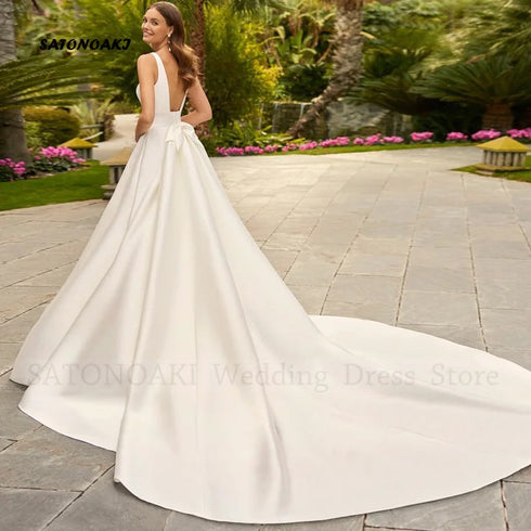Customized Elegant Simple V-Neck Satin Wedding Dress A-Line Bridal Gown with Pockets and Bow