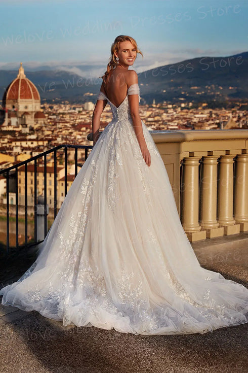 A Line Wedding Dress With Lace Appliques Backless Maternity Friendly Floor Length Elegant Silhouette