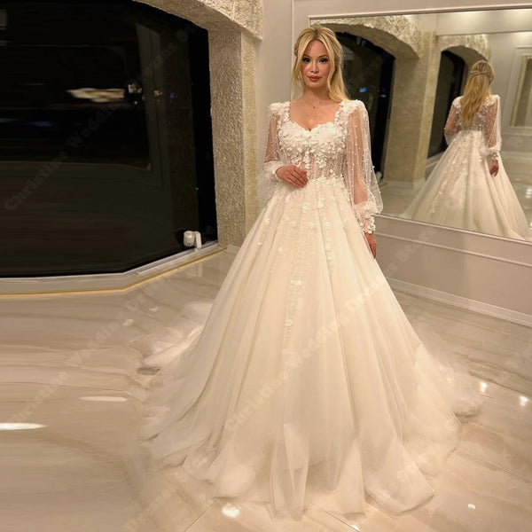 Elegant Long Sleeve Tulle A-Line Bridal Gown with Lace-Up Back for the Perfect Wedding Day