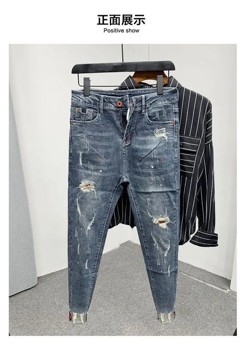 Korean Style Slim Men's Jeans with Cat Whisker Holes and Colorful Paint Splatters - Stylish Medium Wash Jeans for Casual Outfits