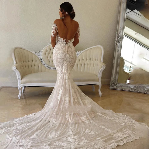 Chic Backless Lace Bridal Gown with Sweetheart Neckline and Long Sleeves