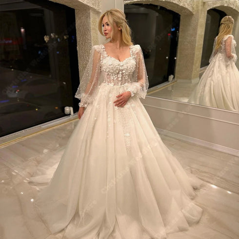 Elegant Long Sleeve Tulle A-Line Bridal Gown with Lace-Up Back for the Perfect Wedding Day